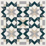 A geometric quilt pattern featuring a repeating star and diamond motif in dark teal, light gray, beige, and white.