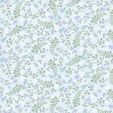 A close-up of a repeating botanical pattern with soft green leaves, small white blossoms, and scattered lavender-purple flowers on a pale icy blue background. A ruler strip appears along the bottom edge.