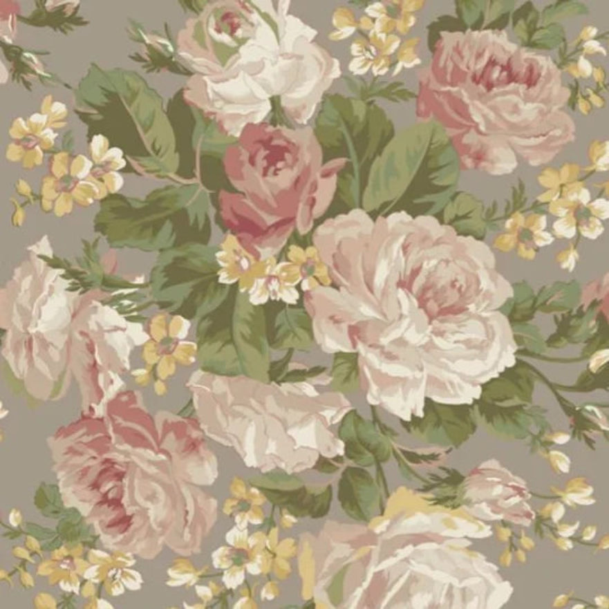 A repeating floral pattern featuring large blush pink and cream roses with green leaves and small yellow blossoms on a warm taupe-gray background.