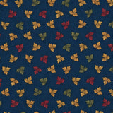 A close-up of a fabric pattern featuring small scattered autumn leaves in red, orange, yellow, and green on a dark blue background, with a white ruler along the bottom edge showing scale.