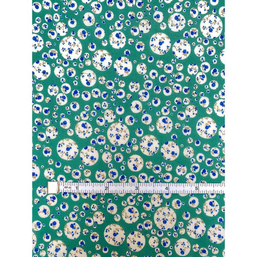 Green Liberty Tana Lawn fabric with white circles and blue floral Joanna Rose print.